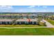 An aerial view of community homes overlooking the golf course with well-maintained grounds at 5685 Palmer Cir # 204, Lakewood Ranch, FL 34211