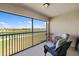Inviting screened balcony with comfortable seating and peaceful views of the water and greenery at 5685 Palmer Cir # 204, Lakewood Ranch, FL 34211