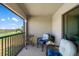 Relaxing balcony with comfortable seating and views of the lake and golf course at 5685 Palmer Cir # 204, Lakewood Ranch, FL 34211