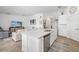 Modern kitchen featuring stainless steel appliances, quartz countertops, and ample cabinet space at 5685 Palmer Cir # 204, Lakewood Ranch, FL 34211