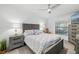 Comfortable main bedroom featuring a ceiling fan, a serene color palette and natural light at 5685 Palmer Cir # 204, Lakewood Ranch, FL 34211