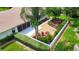 Aerial view of landscaped backyard with gravel, stone, plants, patio, and mature trees at 5705 Garden Lakes Majestic, Bradenton, FL 34203