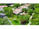 Charming home with lush landscaping, complemented by well-maintained grounds and mature trees at 5705 Garden Lakes Majestic, Bradenton, FL 34203