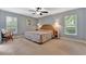 Well-lit bedroom with carpet flooring and overhead lighting at 5705 Garden Lakes Majestic, Bradenton, FL 34203