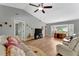 This living room boasts an airy vaulted ceiling, lots of natural light, and wood flooring at 5705 Garden Lakes Majestic, Bradenton, FL 34203