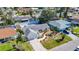 Aerial view of a home with a well-maintained lawn, driveway, and a neatly landscaped front yard at 6012 11Th W Ave, Bradenton, FL 34209