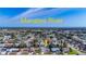 Aerial view of the property with an arrow showing its location on a neighborhood near the Manatee River at 6012 11Th W Ave, Bradenton, FL 34209