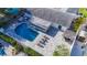 Aerial view showcasing the backyard pool, a lounge area, pergola, and nicely paved stones at 6012 11Th W Ave, Bradenton, FL 34209