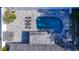 Bird's-eye view of the backyard oasis, including a sparkling pool, lounge area, pergola and nice stone pavers at 6012 11Th W Ave, Bradenton, FL 34209