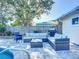 Comfortable backyard seating area with a built-in grill, near the pool at 6012 11Th W Ave, Bradenton, FL 34209