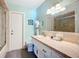 Bright bathroom featuring a tiled vanity, a toilet, and a walk-in shower at 6012 11Th W Ave, Bradenton, FL 34209