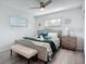 Relaxing bedroom with a well-appointed bed, a cozy bench, and serene decor at 6012 11Th W Ave, Bradenton, FL 34209
