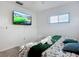 Inviting bedroom featuring a comfortable bed, a modern TV, and plenty of natural light at 6012 11Th W Ave, Bradenton, FL 34209
