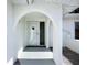 Inviting entryway with arched architecture and a secure screen door at 6012 11Th W Ave, Bradenton, FL 34209