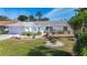 Lovely home with a well-maintained lawn, colorful landscaping, and an attached garage at 6012 11Th W Ave, Bradenton, FL 34209
