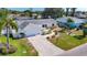 Well-manicured lawn and landscaping in front of a single-story home with an attached two-car garage at 6012 11Th W Ave, Bradenton, FL 34209