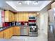 Well-lit kitchen featuring stainless steel appliances, sleek countertops, and modern cabinetry at 6012 11Th W Ave, Bradenton, FL 34209