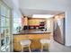 Bright eat-in kitchen with stainless steel appliances and breakfast bar seating at 6012 11Th W Ave, Bradenton, FL 34209