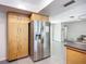 Kitchen with stainless steel refrigerator and lots of cabinet space at 6012 11Th W Ave, Bradenton, FL 34209
