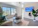 Bright living room featuring large windows, a ceiling fan, and comfortable seating at 6012 11Th W Ave, Bradenton, FL 34209
