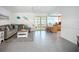 Comfortable living room with an island bar that connects to the bright sunroom at 6012 11Th W Ave, Bradenton, FL 34209