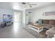 Cozy living room featuring neutral tones, tile floors, and an open doorway to the outdoor area at 6012 11Th W Ave, Bradenton, FL 34209