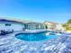 Sparkling backyard pool with paved patio, sun loungers, and outdoor seating area at 6012 11Th W Ave, Bradenton, FL 34209