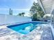 Inviting pool area features a sparkling pool, stainless steel ladder and cool deck for relaxing in the sun at 6012 11Th W Ave, Bradenton, FL 34209