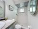 Bright shower area with a tiled surround and a glass door at 6012 11Th W Ave, Bradenton, FL 34209