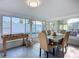 Enclosed sunroom featuring dining area and foosball table with views of the pool at 6012 11Th W Ave, Bradenton, FL 34209