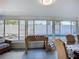 Sun room featuring foosball table and dining area with views of the pool at 6012 11Th W Ave, Bradenton, FL 34209
