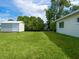 This backyard is spacious with shed and the house on the right at 6116 Rodgers Ave, Sarasota, FL 34231