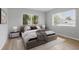 Comfortable bedroom with plush bedding, neutral colors, and bright natural light at 6116 Rodgers Ave, Sarasota, FL 34231