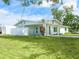 Charming single-story home boasting a well-kept lawn and a cozy carport, providing comfort and convenience at 6116 Rodgers Ave, Sarasota, FL 34231