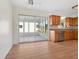 Kitchen area featuring wood cabinetry, stainless steel appliances, and sliding doors to enclosed porch at 6116 Rodgers Ave, Sarasota, FL 34231