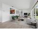 Bright living room with large windows, hardwood floors, and stylish furniture at 6116 Rodgers Ave, Sarasota, FL 34231