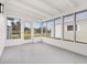 This sun room is filled with windows and a door to the outside at 6116 Rodgers Ave, Sarasota, FL 34231