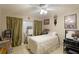 Bedroom featuring a comfortable bed, a desk, and a dresser for optimal storage and organization at 620 Burke Rd, Venice, FL 34293