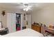 Inviting bedroom with ceiling fan, closet, and dresser, providing a serene retreat at 620 Burke Rd, Venice, FL 34293