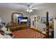 Spacious bedroom with a four-poster bed, dresser, and plenty of natural light at 620 Burke Rd, Venice, FL 34293
