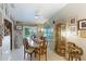 Dining room with elegant marble table, decorated with framed pictures and decor at 620 Burke Rd, Venice, FL 34293