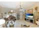 Elegant living room featuring a chandelier, decorative furniture, and neutral wall color at 620 Burke Rd, Venice, FL 34293