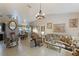Elegant living room featuring a chandelier, decorative furniture, and neutral wall color at 620 Burke Rd, Venice, FL 34293