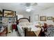 Bedroom featuring a king-size bed, ceiling fan, and neutral color scheme at 620 Burke Rd, Venice, FL 34293
