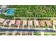 Overhead community view showcasing homes, road, and nearby tennis court at 6240 Falcon Lair Dr, North Port, FL 34287
