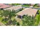 Overhead view of a backyard with mature trees and well-manicured landscaping, offering a private outdoor space at 6240 Falcon Lair Dr, North Port, FL 34287