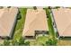 Aerial shot highlights the home's backyard and nearby landscaping at 6240 Falcon Lair Dr, North Port, FL 34287