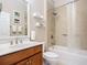 Cozy bathroom featuring a shower and tub combo and a wood vanity with good storage at 6240 Falcon Lair Dr, North Port, FL 34287