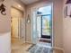 Inviting foyer with decorative accents and tile flooring, leads to a bright, open floor plan at 6240 Falcon Lair Dr, North Port, FL 34287