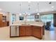 Bright kitchen featuring stainless steel appliances and a convenient breakfast bar at 6240 Falcon Lair Dr, North Port, FL 34287